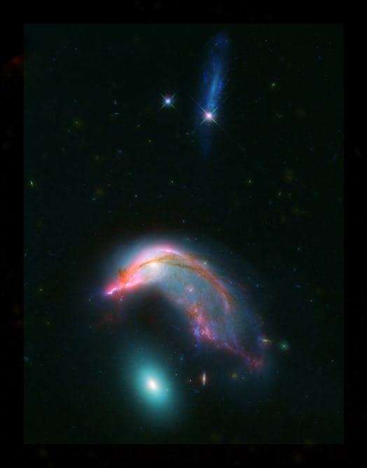 Distant interacting galaxies, known collectively as Arp 142, bears an uncanny resemblance to a pengu...
