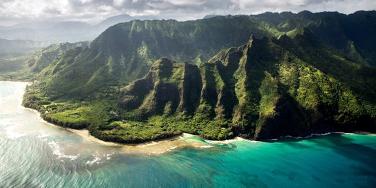 Mountains on land next to the sea