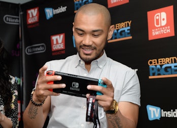 Actor Alex Mallari Jr from the television series 'Dark Matter' with a Nintendo Switch.