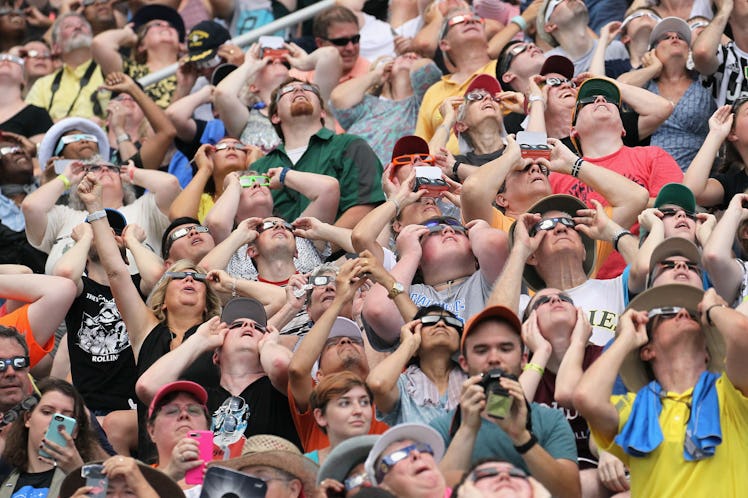 People watching the solar eclipse at Saluki Stadium