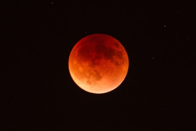 A supermoon coinciding with a lunar eclipse