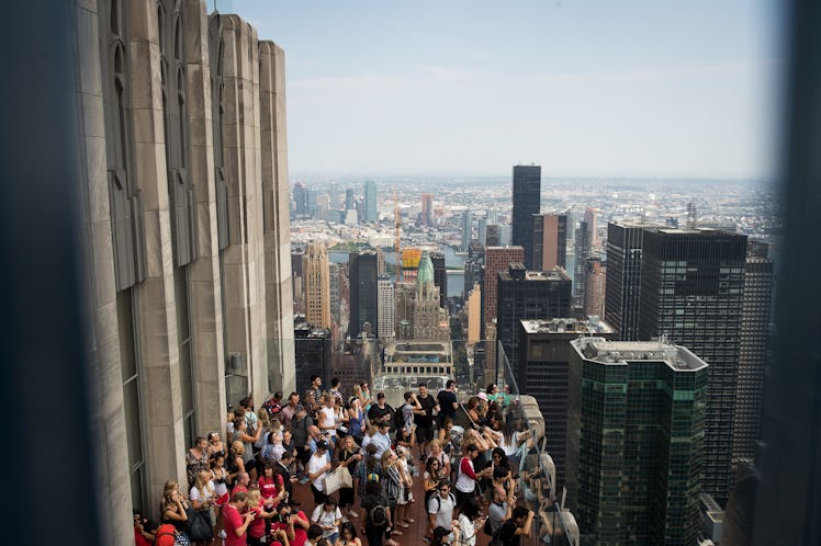 People looking at the eclipse On New York City’s “Top of the Rock” observatory