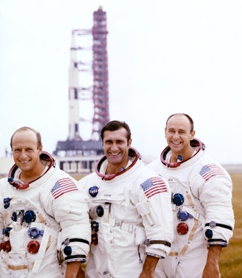 From left to right: Pete Conrad, Dick Gordon, and Alan Bean pose with their Apollo 12 Saturn V moon ...