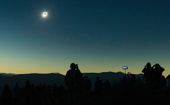 Thousands of tourists and locals gathered to watch at La Higuera, Chile. CREDIT: Esteban Felix/AP/Sh...