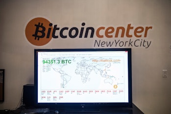 NEW YORK, NY - FEBRUARY 26: A television screen displays various bitcoin rates at Bitcoin Center NYC...