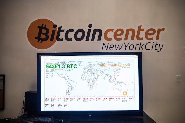NEW YORK, NY - FEBRUARY 26: A television screen displays various bitcoin rates at Bitcoin Center NYC...