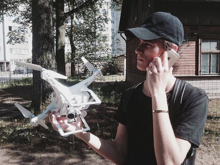 Geskin holding a drone.