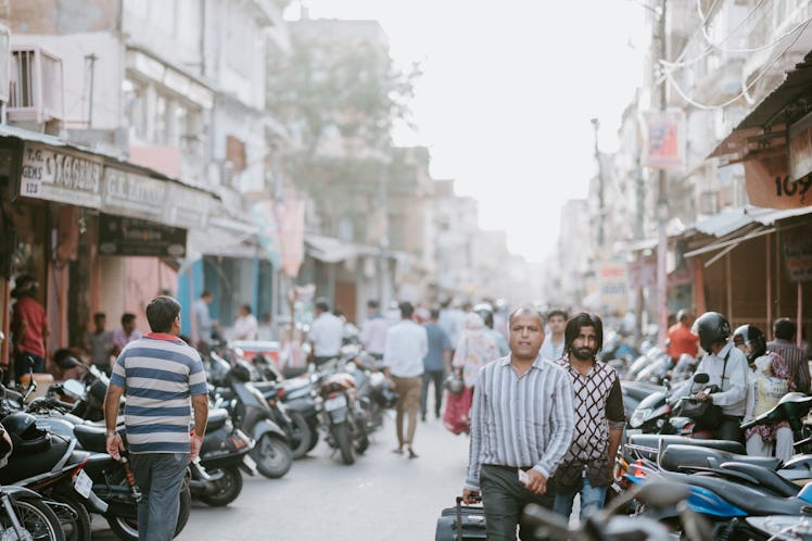 People walking down a Delhi street