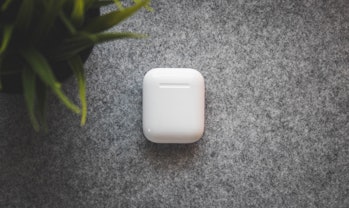The AirPods come in a small charging case.