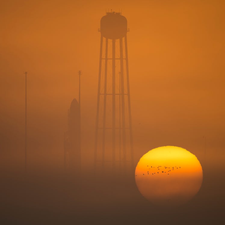 The Orbital ATK Antares rocket, with the Cygnus spacecraft onboard, stands on launch pad, waiting to...