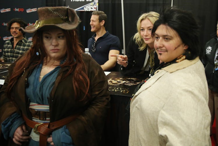 Luke Arnold, Tom Hopper, and Clara Paget sign autographs for fans 