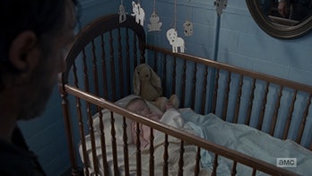 Baby Gracie has a stuffed rabbit tucked in her crib when Rick finds her.