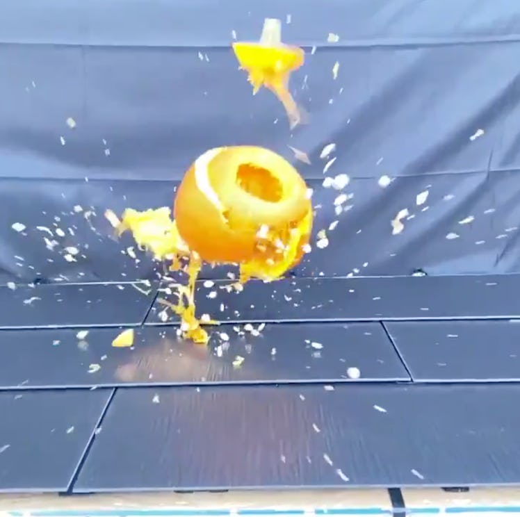 Tesla Solar Roof getting hit by a pumpkin.