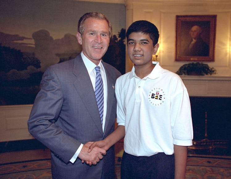 2002 Scripps National Spelling Bee Winner Pratyush Buddiga and President George W. Bush shaking hand...