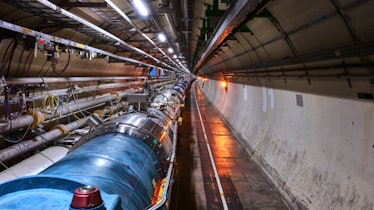 View of the LHC in its tunnel at CERN. The LHC is a 27-kilometer-long underground ring of supercondu...