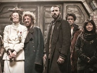 The cast from the 'Snowpiercer' TV show standing together in a scene from the show