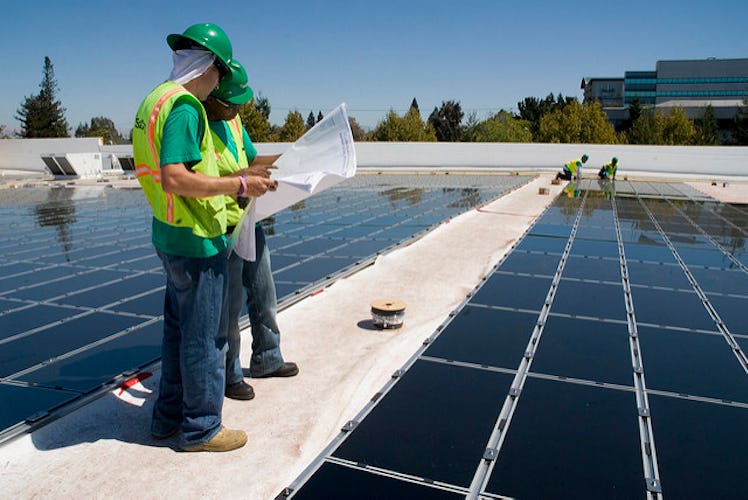Solar energy panels getting installed on Walmart rooftop 