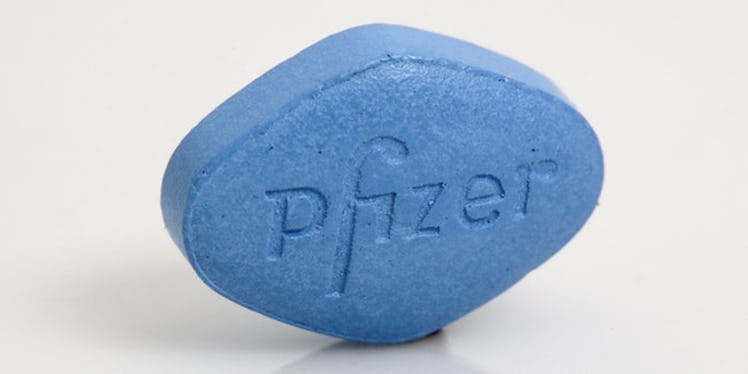 A blue pill with "Pfizer" text on it