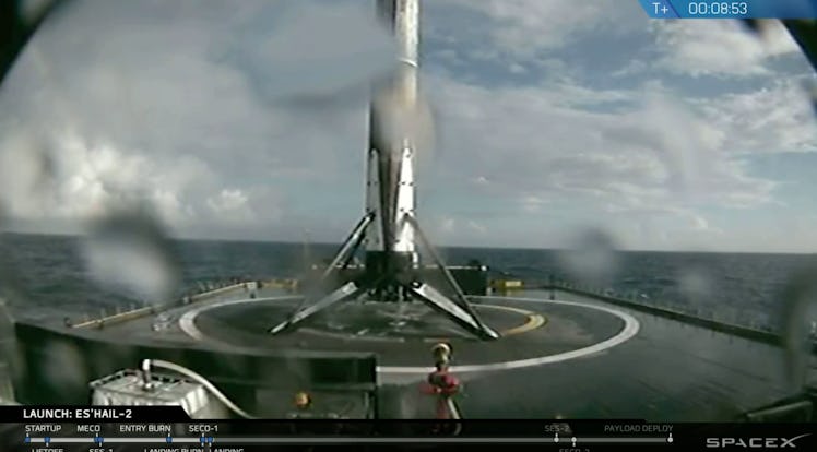 This image of the Falcon 9 first stage shows the rocket upright on the deck of the autonomous drones...