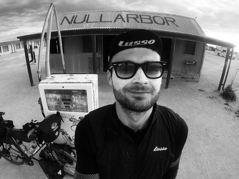 Dr. Mike Nally taking a selfie next to his bike