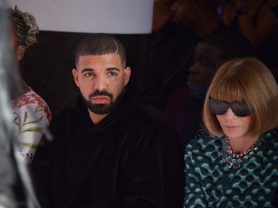 Drake sitting next to Anna Wintour during a fashion show.