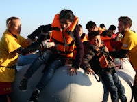 A group of Syrian refugees on a safeboat