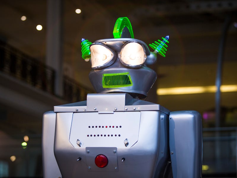 A robot with a purple head and green spikes 