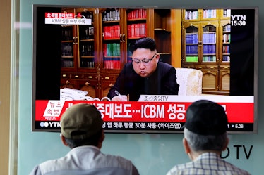 SEOUL, SOUTH KOREA - JULY 04: People watch a North Korea's KRT television show as a presenter announ...
