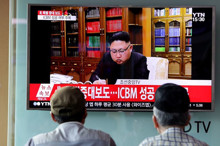 SEOUL, SOUTH KOREA - JULY 04: People watch a North Korea's KRT television show as a presenter announ...