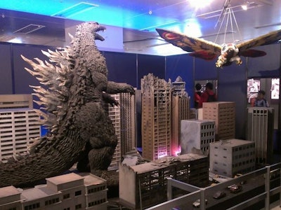 Godzilla toy on a city model