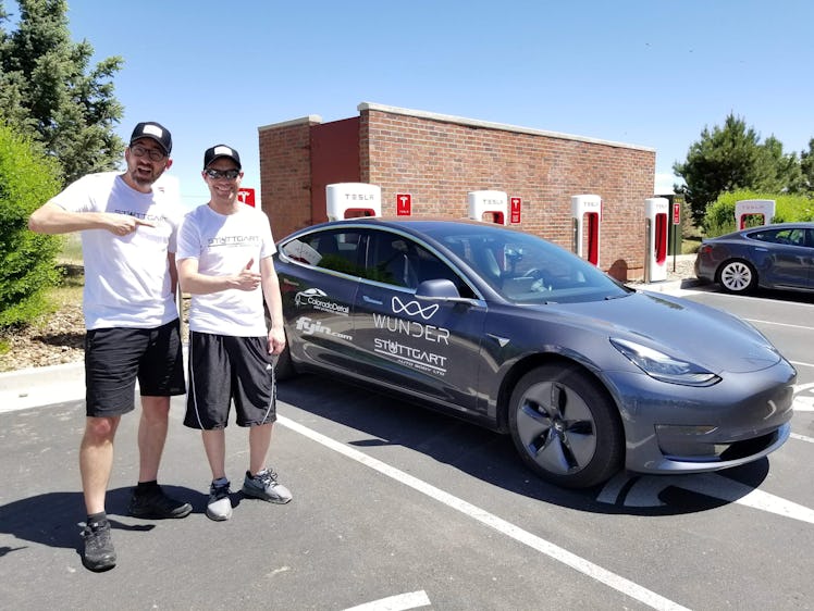 The pair next to their car.