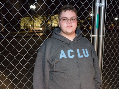Gavin Grimm in a grey and blue ACLU hoodie with a neutral facial expression.