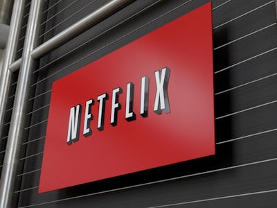 A large Netflix poster sign hanged on a black wall