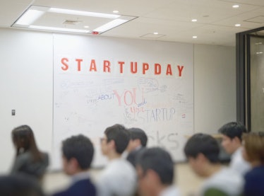 White board with orange "startupday" text