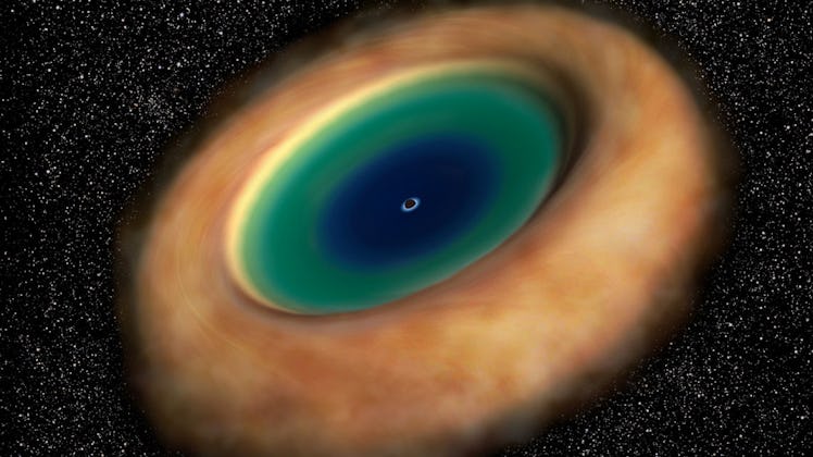 Illustration showing the ring of dust and gas with the supermassive black hole in the center. The di...