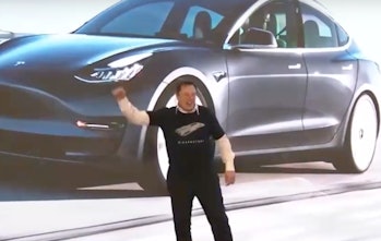 Musk dances onto the stage.