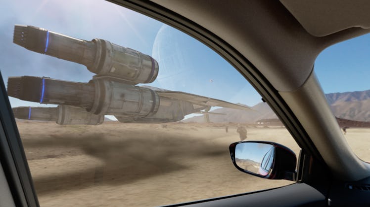 Nissan car next to the Star Wars battlefield.