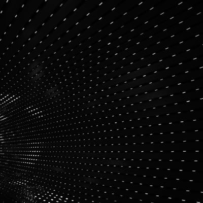 Unsplash photo of white dotted lines on a black background