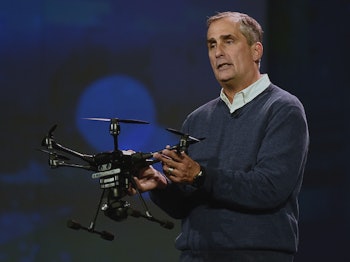 Brian Krzanich holding a black drone 