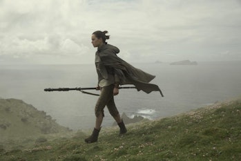 Daisy Ridley as Rey walking on Ahch-To in 'Star Wars: The Last Jedi'