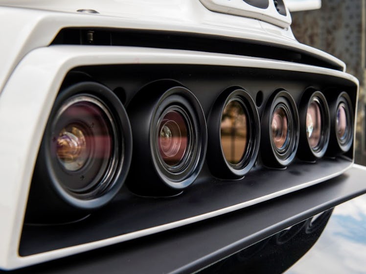 Six lenses are mounted on the roof of Uber's self-driving test car.