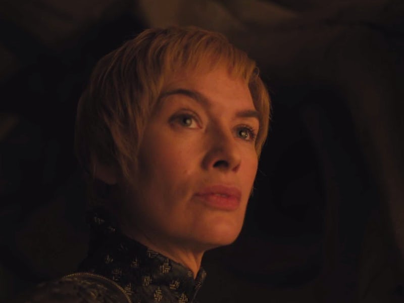 A closeup of Cersei in Game of Thrones looking into the distance 