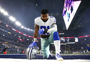 ARLINGTON, TX - DECEMBER 26: Ezekiel Elliott #21 of the Dallas Cowboys takes a knee in the end zone ...
