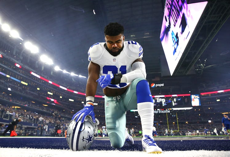 ARLINGTON, TX - DECEMBER 26: Ezekiel Elliott #21 of the Dallas Cowboys takes a knee in the end zone ...