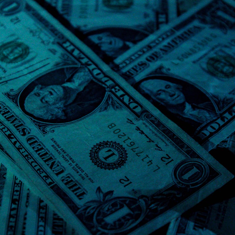 Dollar bills stacked on top of each other
