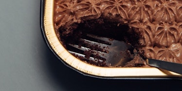 A fork inside a chocolate cake