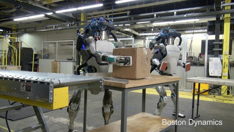 Robots moving a package around a factory