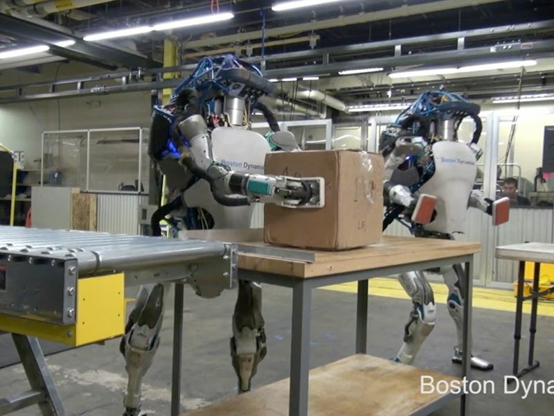 Robots moving a package around a factory