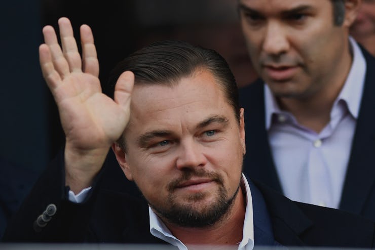 Leo DiCaprio waving at a crowd.