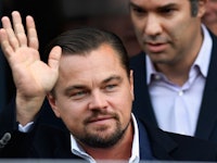 Leo DiCaprio waving at a crowd.